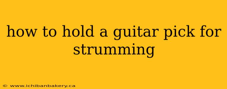 how to hold a guitar pick for strumming